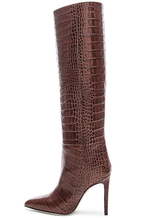 brown crocodile knee high boots.